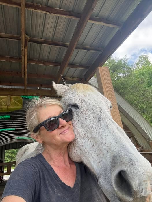 Lynn, founder of BellaSoul Farm, cheek to cheek with Ghost