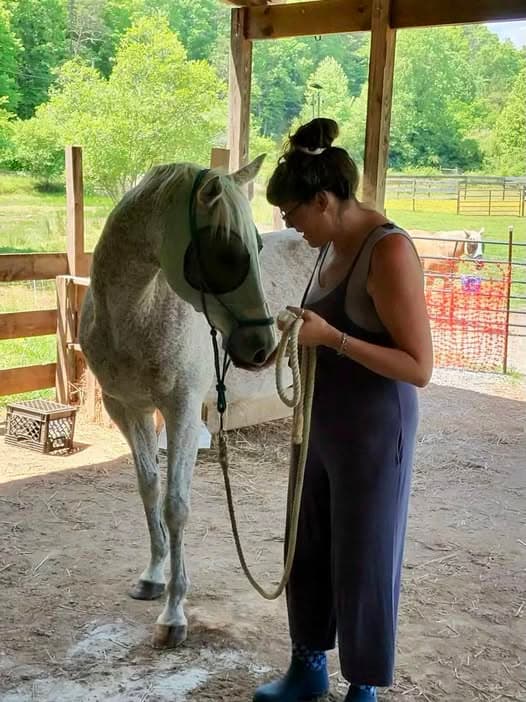 A gentle moment with Ghost the horse